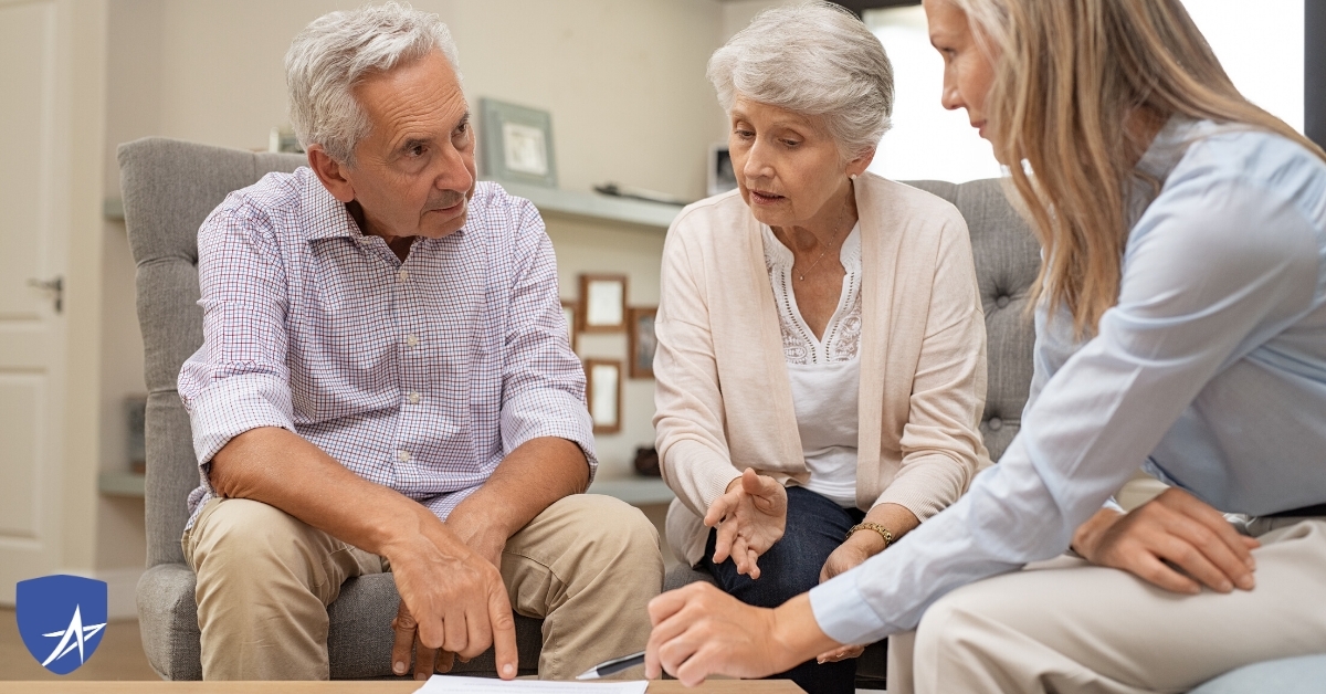 senior couple with insurance agent