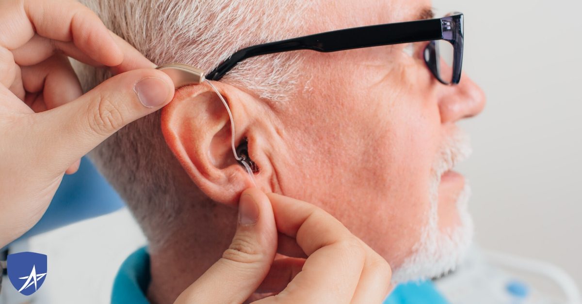senior man being fitted for hearing aids